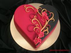کیک تولد دخترانه قرمز تم قرمز و مشکی طرح پیچک