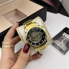 ساعت مچی مردانه رولکس ROLEX  طرح اسکلتون طلایی چرخ دنده نمایان باجعبه و باتری 1668