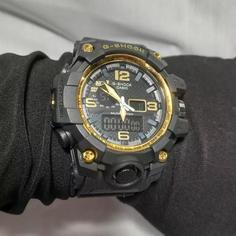 ساعت مچی دیجیتال عقربه ای جی شاک مشکی دور قاب طلایی G-SHOCK